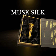 Musk Silk attar bottle displayed in a luxurious box with black satin lining.