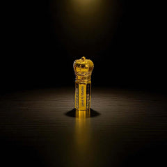Oud Malaki organic Arabian Oud Oil in a luxurious gold bottle with crown design, showcasing elegance.