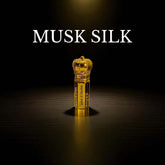Musk Silk attar bottle with elegant design, showcasing the luxurious fragrance in a gold-colored bottle.