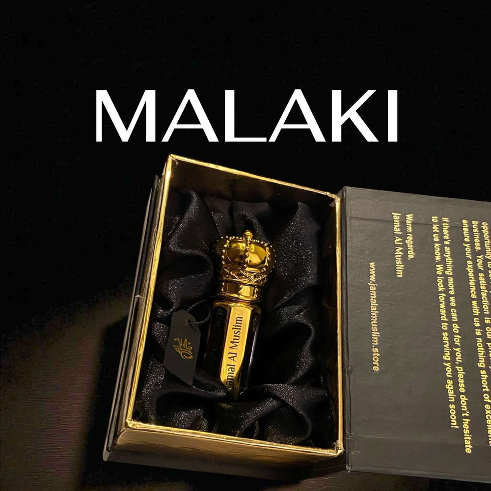 Oud Malaki organic Arabian Oud Oil presented in an elegant golden bottle, showcasing luxury and sophistication.
