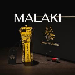 Oud Malaki organic Arabian Oud Oil bottle and packaging showcasing luxury and elegance.