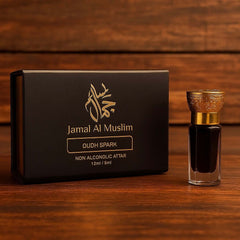 OUD SPARK attar by Jamal Al Muslim, 12ml bottle with elegant packaging on a wooden background.