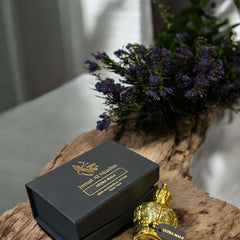 Ultra Male Perfume Oil bottle and box with flowers, showcasing bold fragrance for confident men.