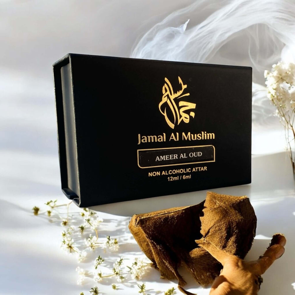 Ameer Al Oud by Jamal Al Muslim, 12ml non-alcoholic attar packaging with oud wood and floral accents.