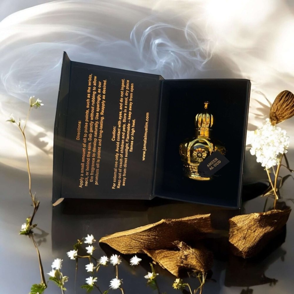 Boxed Ameer Al Oud perfume in an elegant presentation with floral accents and smoke background.