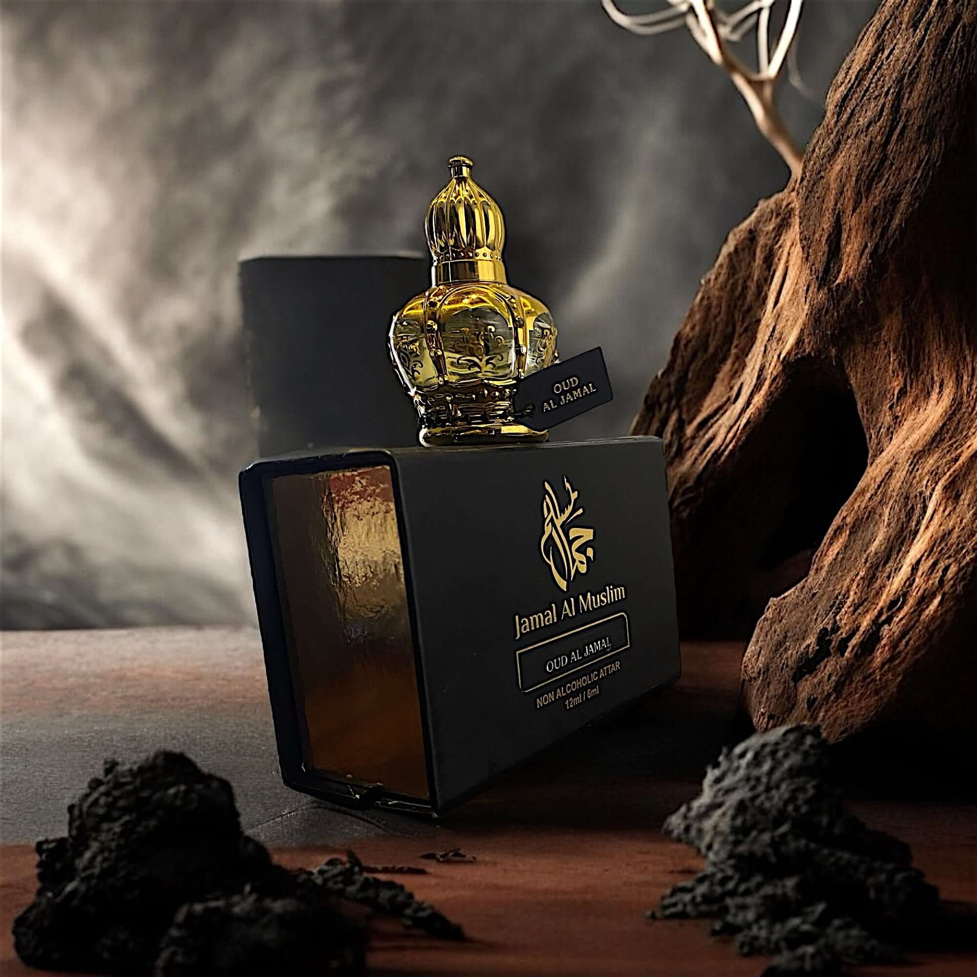 Oud Al Jamal 12ML perfume bottle elegantly displayed on a wooden surface with dark accents.