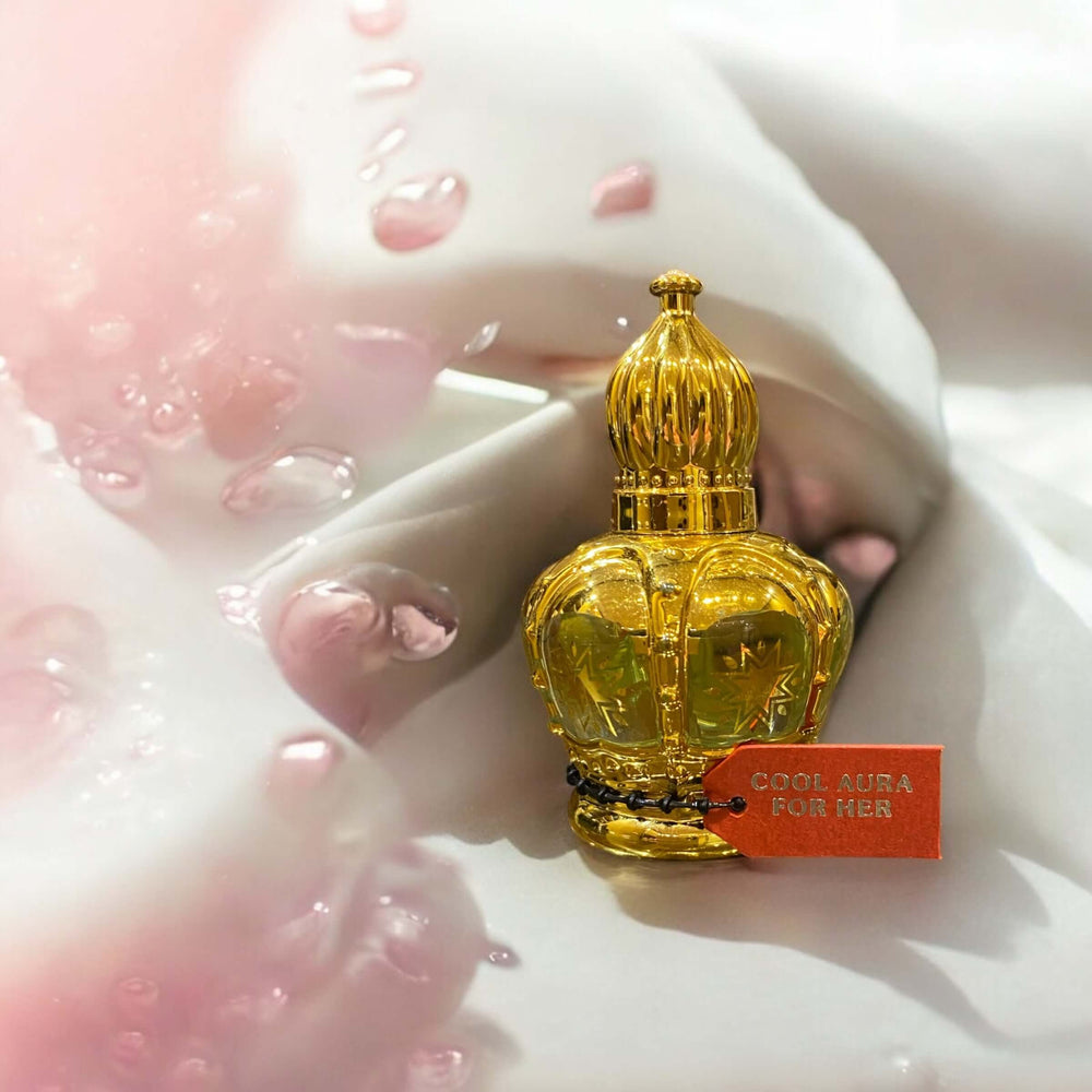 Cool Aura for Her - Refreshing Women's Perfume Oil in a decorative bottle with water droplets.