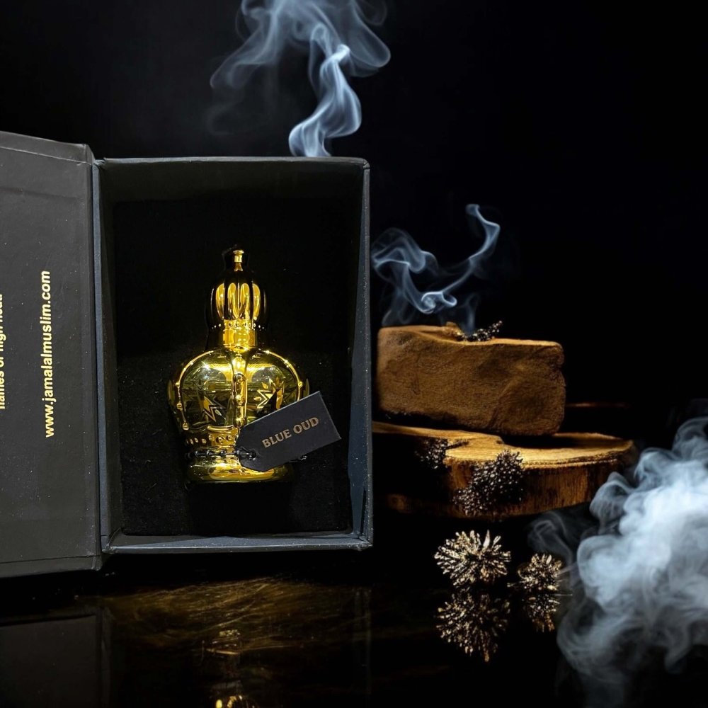 Golden crown bottle of Saudi Arabian Blue Oud perfume oil in luxurious packaging with smoke and oud pieces.
