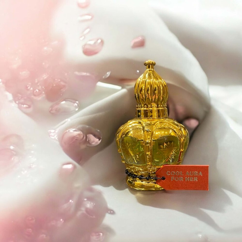 Cool Aura for Her - Refreshing Women's Perfume Oil in a decorative bottle with water droplets.