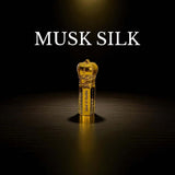 Musk Silk attar bottle with elegant design, showcasing the luxurious fragrance in a gold-colored bottle.